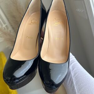 Red Soles women platform pumps. Almost new. Great Condition.